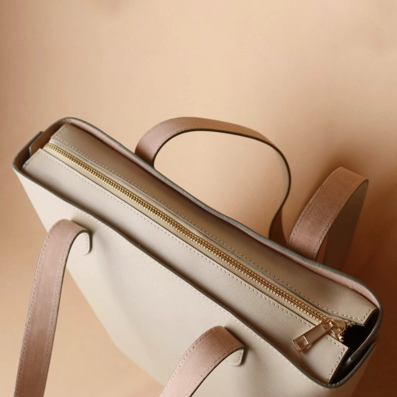Top Closed Gold Zipper View of a White Leather Tote Bag for Women