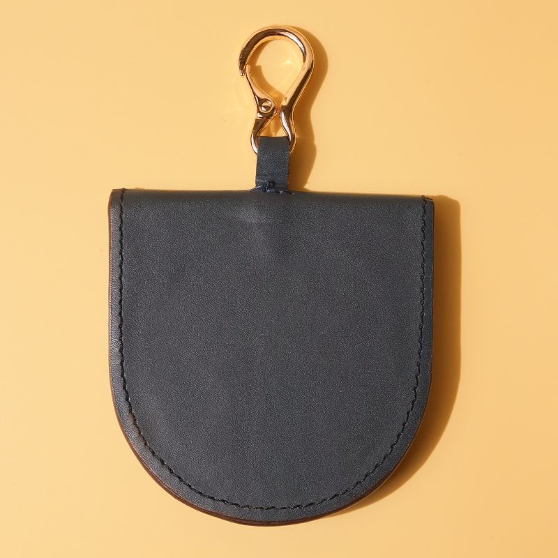 Hanging Vanity Mirror Case-Deep Blue leather-gold plated metal hook-polished glass mirror-front top angle view-The Bicyclist