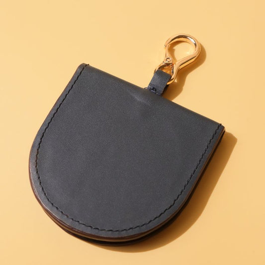 Hanging Vanity Mirror Case-Deep Blue leather-gold plated metal hook-polished glass mirror-front angle view-The Bicyclist