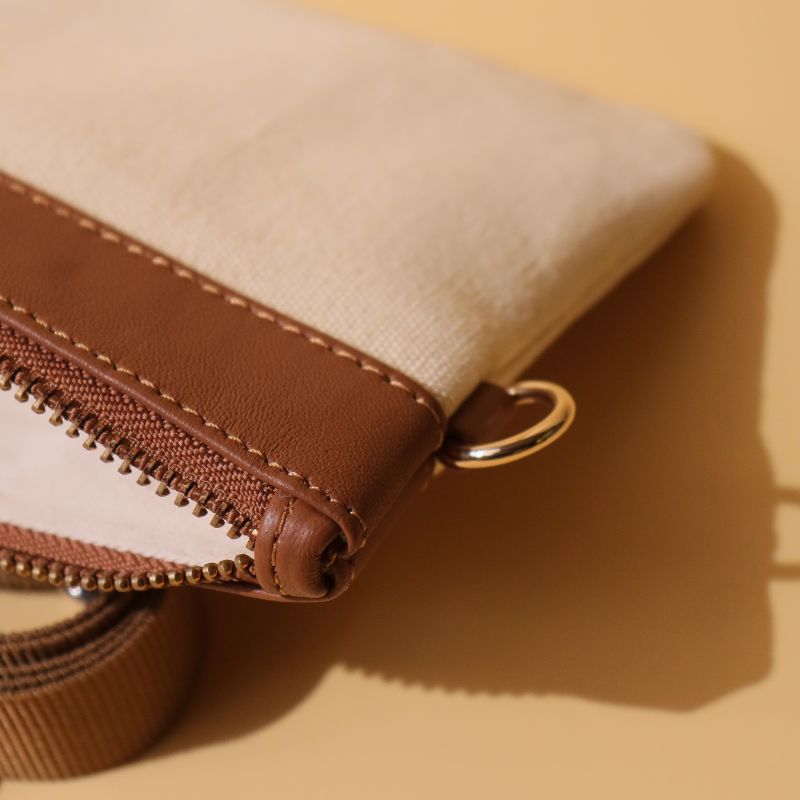 Canvas and Leather Compact Pouch Sling Bag-Off White Canvas and tan leather-gold plated metal hook-front detail view-The Bicyclist