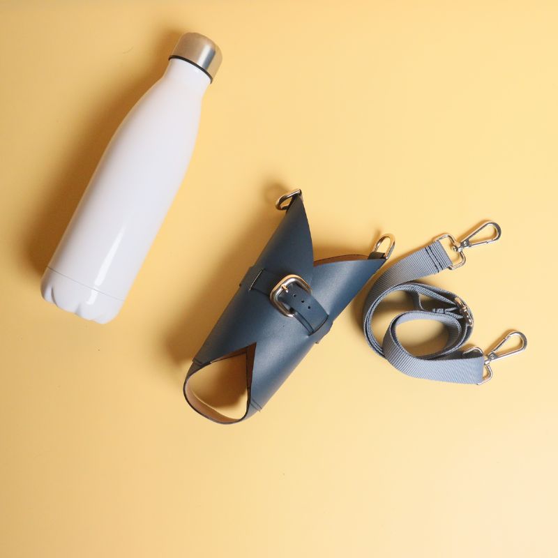 Leather Bottle Holder Sling Carrier-deep blue leather straps-gold plated metal hook-front dismantled angle view-The Bicyclist