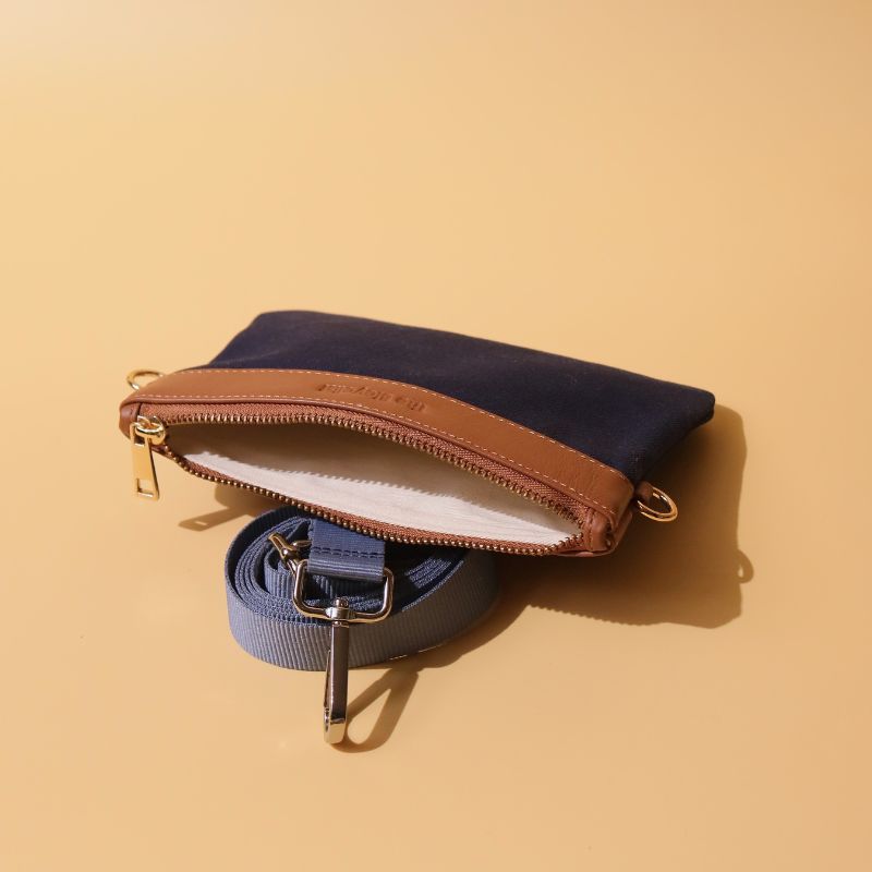 Canvas and Leather Compact Pouch Sling Bag-Deep Blue Canvas and tan leather-gold plated metal hook-front open-The Bicyclist