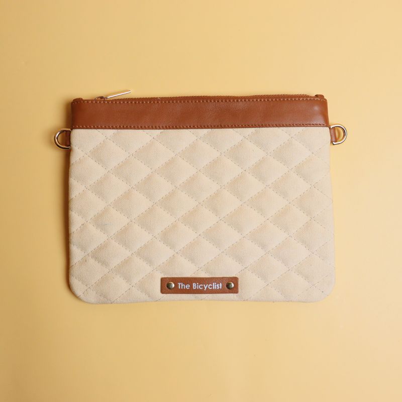 Canvas and Leather Pouch Sling Bag-Off-white Canvas and tan leather-gold plated metal hook-front view-The Bicyclist