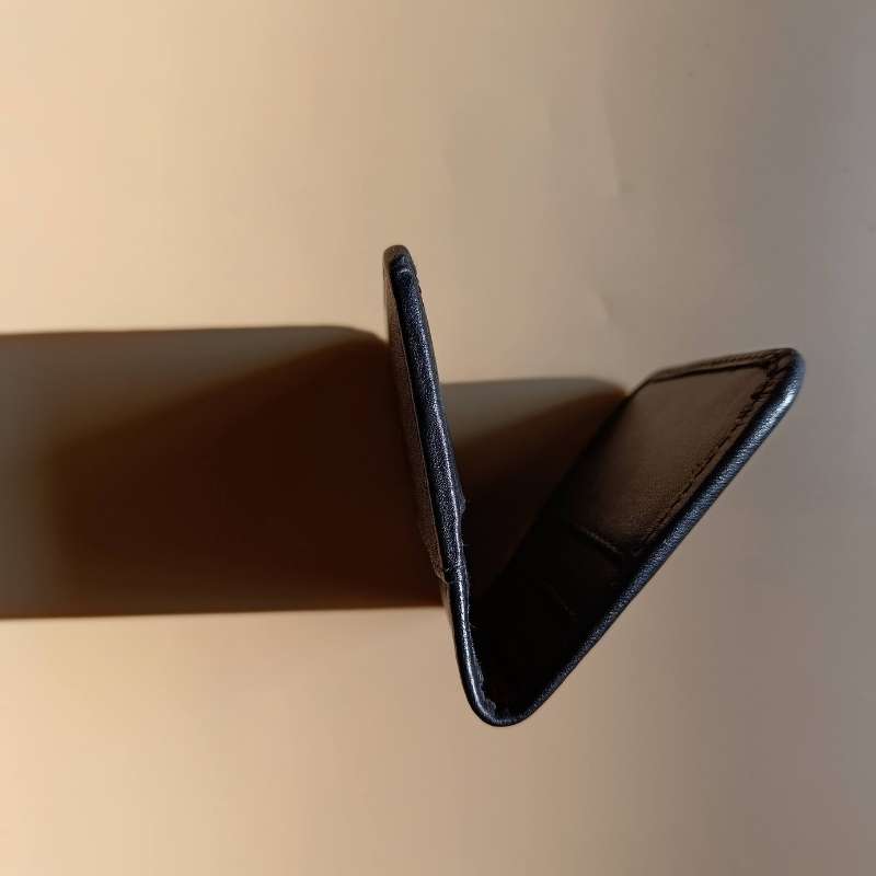 Side Edge Detail of a Bifold Leather Card Wallet in Black