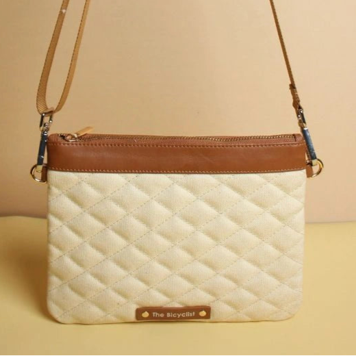 Canvas and Leather quilted zip Pouch Sling Bag-Off-white Canvas and tan leather-gold plated metal hook-front standing view-The Bicyclist