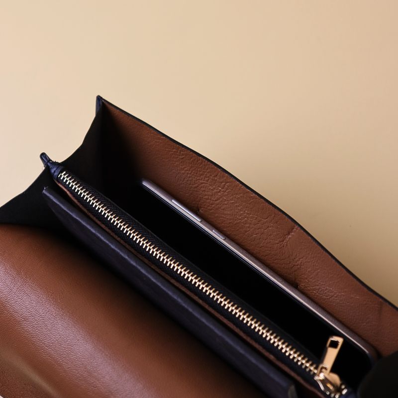 Open View of a Large Clutch Wallet for Women with Light Brown Sheep Leather Lining, a compartment for a cellphone, a compartment for a small black diary and a metal zip pouch
