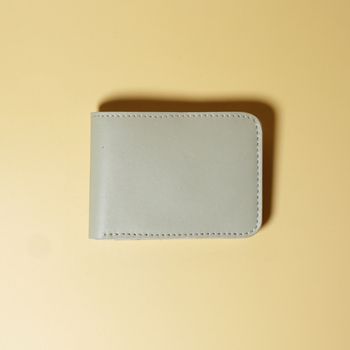 Off White bifold leather wallet on a beige background