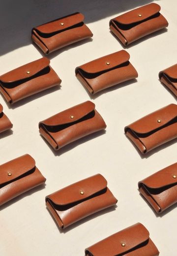 Tan Leather Card Holder for Men on a white background.