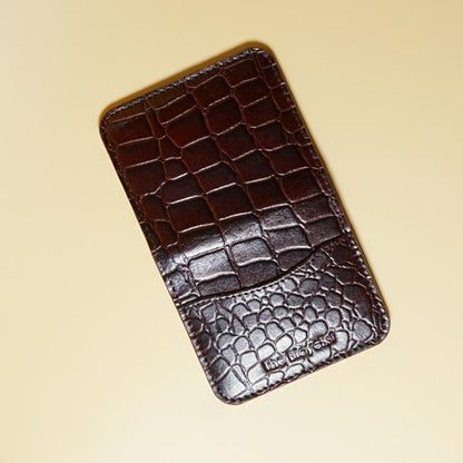 Maroon Leather crocodile-patterned cardwallet on a beige background