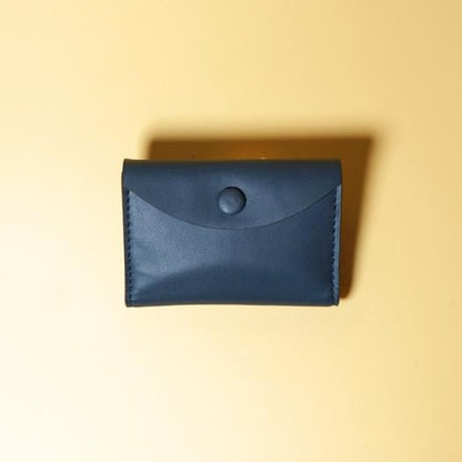 Blue leather wallet on a yellow background