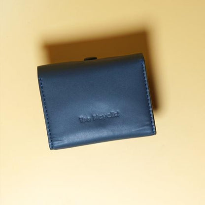 Blue Leather wallet with a brand, The Bicyclist embossed on it