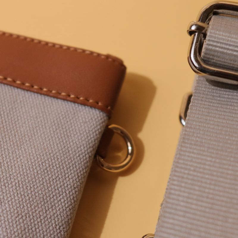 Canvas and Leather Compact Pouch Sling Bag-Light Grey Canvas and tan leather-gold plated metal hook-detail-The Bicyclist