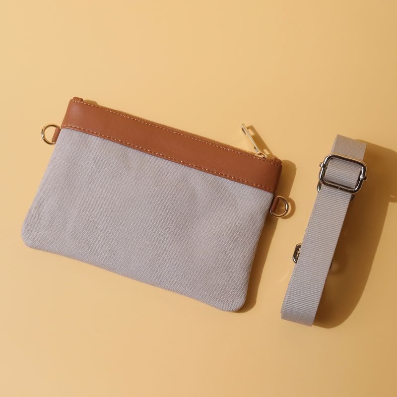 Canvas and Leather Compact Pouch Sling Bag-Light Grey Canvas and tan leather-gold plated metal hook-back angle view-The Bicyclist