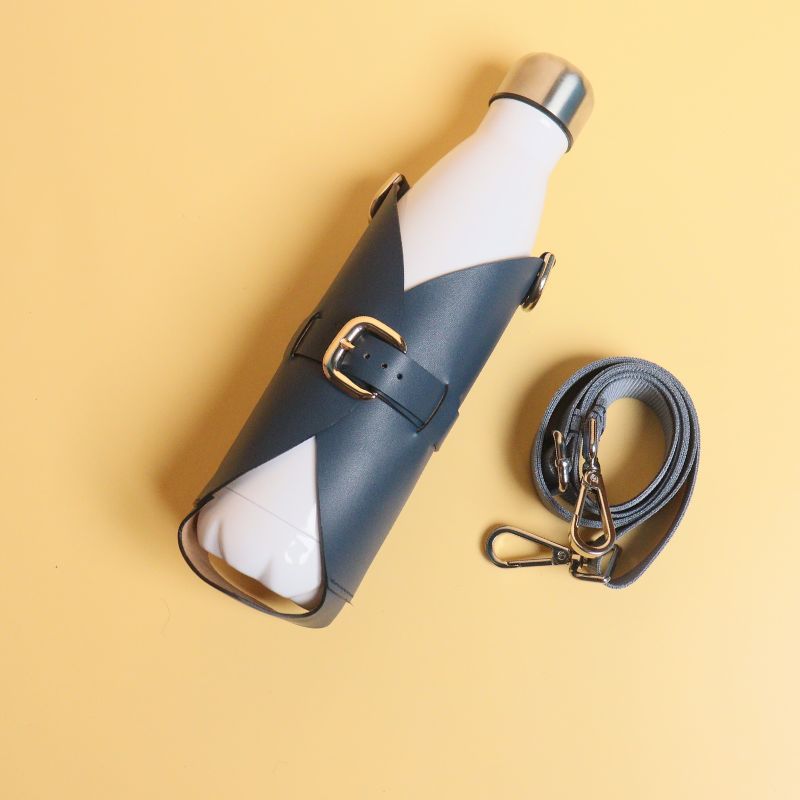 Leather Bottle Holder Sling Carrier-deep blue leather straps-gold plated metal hook-front top angle view-The Bicyclist