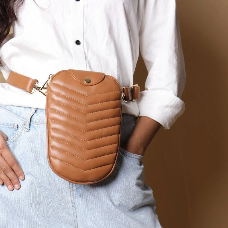 Woman in a white shirt Carrying a leather quilted fanny pouch bag around her waist