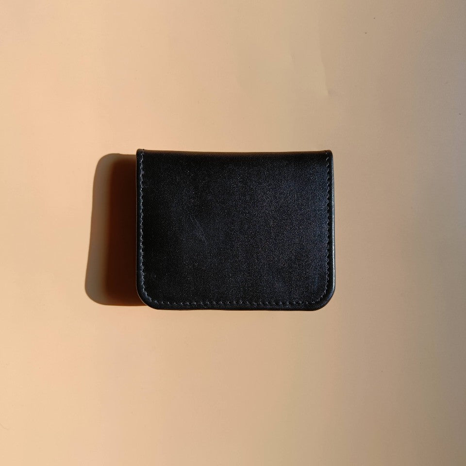 Handmade Leather unisex bifold card wallet-black-fullgrain leather body-purple sheep leather lining-back view-The Bicyclist