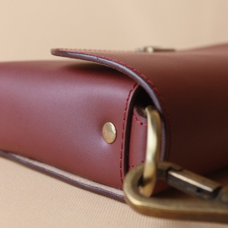 Burgundy sling bag clearance
